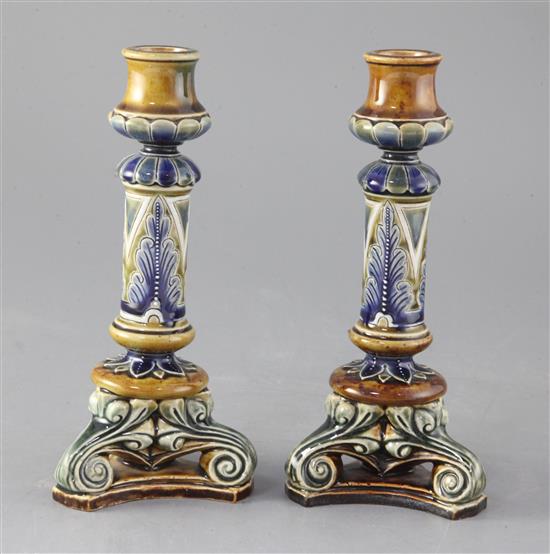 A pair of Doulton Lambeth stoneware candlesticks, decorated by Frank Butler, 20cm